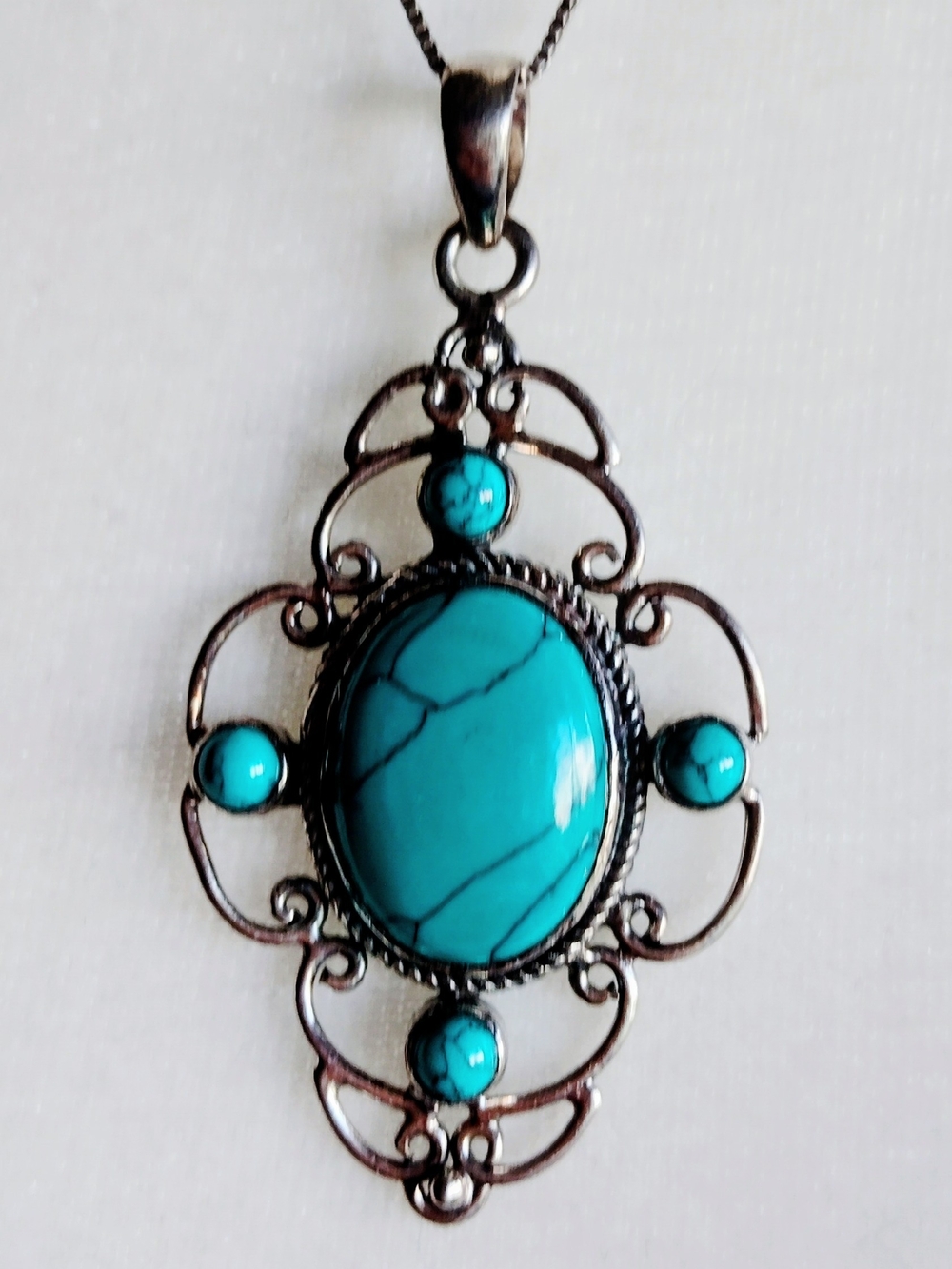Genuine Turquoise Oval Pendant in Silver Plated Setting